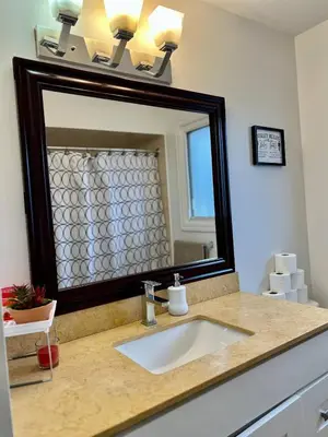 a bathroom with a sink and a large mirror at Private Room Near Airport K5 in Mississauga