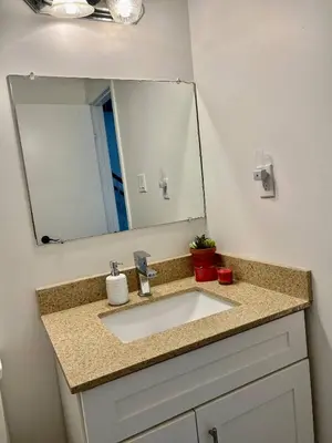 a bathroom with a sink and a mirror at Private Room Near Airport K5 in Mississauga