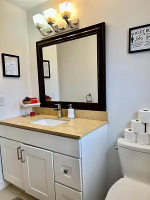 a bathroom with a sink and a mirror at Private Room Near Airport K5 in Mississauga