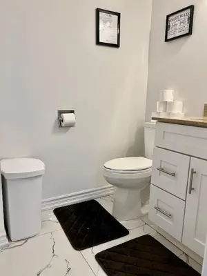 a white bathroom with a toilet and a sink at Private Room Near Airport K4 in Mississauga
