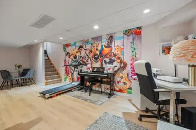 an office with a large painting of tigers on the wall at Ninos place in Hamilton