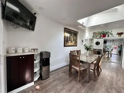a kitchen and dining room with a table and chairs at Riverwood Home-Entire Rental Unit in Mississauga