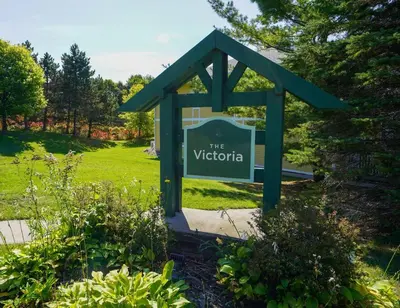 a sign for the victoria sign in a garden at Stunning Condo with Access to Pool in Shanty Bay