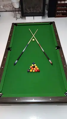 a green pool table with two cue balls and two darts at Renovated Church Hamilton! Guest Suite in Hamilton