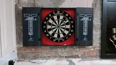 a dart board on a brick wall at Renovated Church Hamilton! Guest Suite in Hamilton