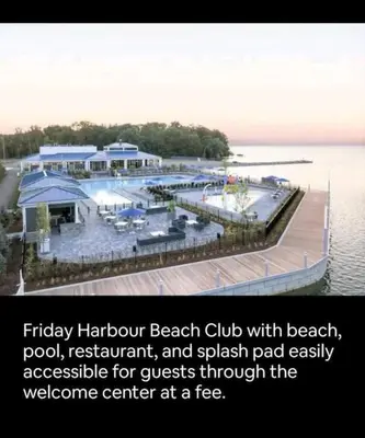 a beach club with a dock in the water at Nature trail view with cozy patio and firetable in Innisfil