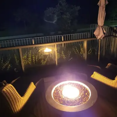 Nature trail view with cozy patio and firetable
