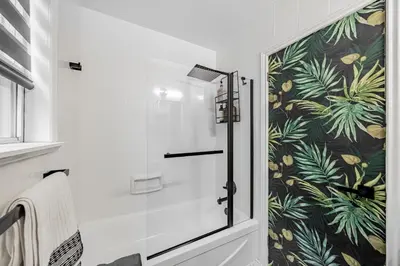 a shower with a glass door in a bathroom at Unique Oasis with Tri-City Access in Mississauga