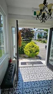 an open door with a view of a yard at Serenity Inn in Niagara Falls