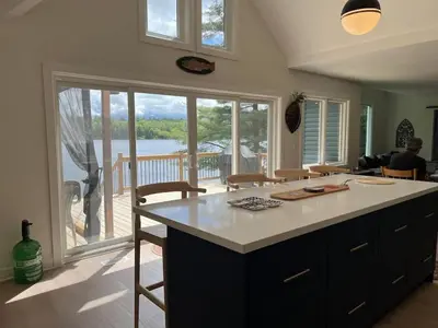 a kitchen with a counter and a view of a deck at Davi's Lake House in Torrance
