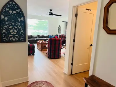 a hallway with a living room with a couch at Davi's Lake House in Torrance