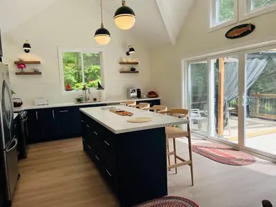 a kitchen with a large island in the middle at Davi's Lake House in Torrance