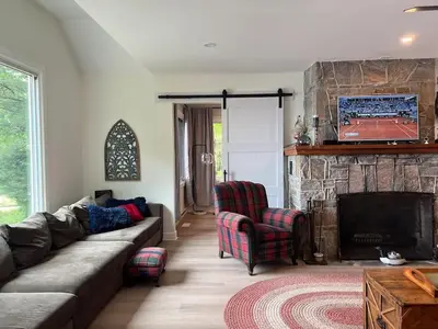 a living room with a couch and a fireplace at Davi's Lake House in Torrance