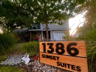 a sign in front of a house with a suntrust sign at Sunset Suites in Niagara Wine Country in Niagara on the Lake