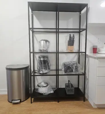 a black shelving unit in a kitchen at SPRUCE Private Suite with attached Full Bathroom in Toronto, Canada in Toronto