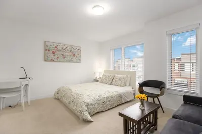 a bedroom with a bed and a desk and a chair at SPRUCE Private Suite with attached Full Bathroom in Toronto, Canada in Toronto