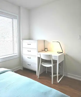 a bedroom with a desk with a lamp on it at Private Room M A P L E with Attached Full Bathroom in Toronto, ON, Canada in Toronto
