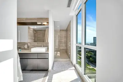 a bathroom with a sink and a large window at RentX 3Bedroom Penthouses near Rogers Centre & MTCC in Toronto