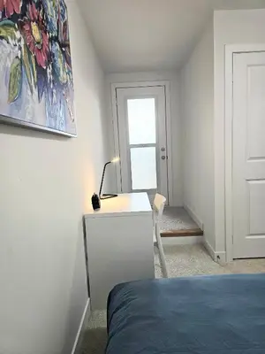 a bedroom with a bed and a desk and a window at CEDAR Double Room with attached private Bathroom and Balcony in Toronto, ON, Canada in Toronto