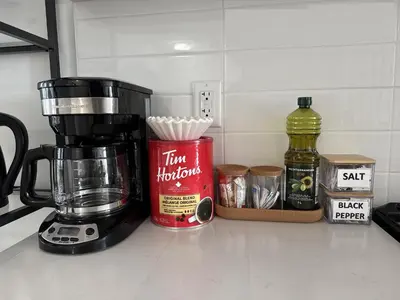 a coffee maker on a counter next to some ingredients at CEDAR Double Room with attached private Bathroom and Balcony in Toronto, ON, Canada in Toronto