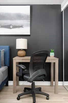 an office with a desk and a chair at Lakeside Haven - Cozy Townhome in Liberty Village in Toronto
