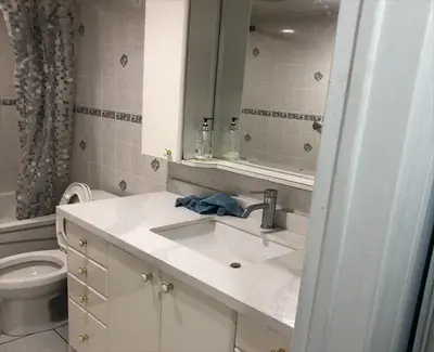 a bathroom with a sink and a toilet at SHAY-BASEMENT-Holiday Home in Pickering