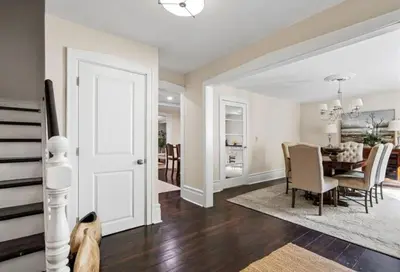 a dining room and living room with a dining table at Hummingbird Haven Bed & Breakfast Luxury Suite With Terrace & Seasonal Lake Views Located in Historic Old Town Niagara-On-The-Lake in Niagara on the Lake