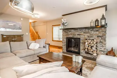 a living room with a couch and a fireplace at Muskoka Lakeshore Cottage Bliss in Gravenhurst