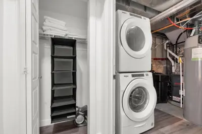 a laundry room with a washer and dryer at Modern 2BR Duplex 3.0 GBPS internet with Parking in Kitchener