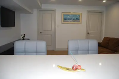 a banana and fruit on a table in a living room at Modern 2-BR Basement Apartment in Richmond Hill