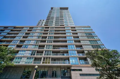 a tall building with a lot of windows at Designer 2BR Downtown Condo, Rogers Center in Toronto