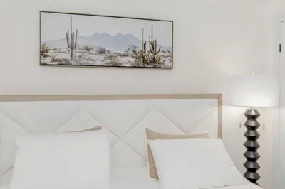 a bedroom with a bed with a picture on the wall at South Oakville Bliss Haven Monthly Stays only in Oakville