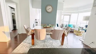 a dining room with a table and chairs at Superior Lakeview Luxury 3-Bedroom Suite on High Floor in Toronto