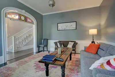 a living room with a couch and a table at Historic Home in the Heart of Elora in Elora