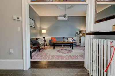 a living room with a couch and a table at Historic Home in the Heart of Elora in Elora