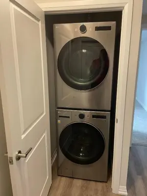 a washer and dryer in a small room at Modern, well-equipped, and centrally located in Fonthill