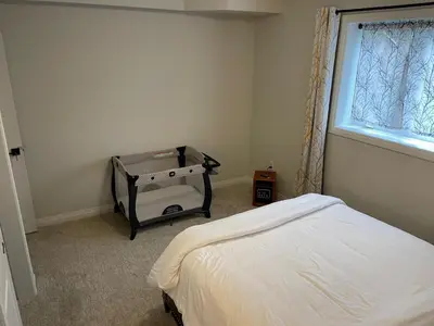 a bedroom with a bed and a window at Modern, well-equipped, and centrally located in Fonthill