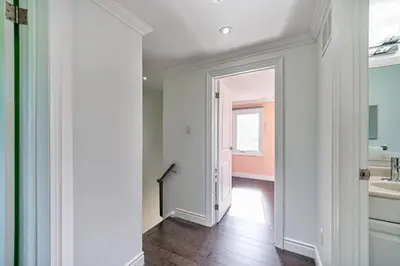 an empty hallway with a bathroom and a sink at 4BR Scarborough Gem, Freshly Renovated, 7 Car Parking in Toronto