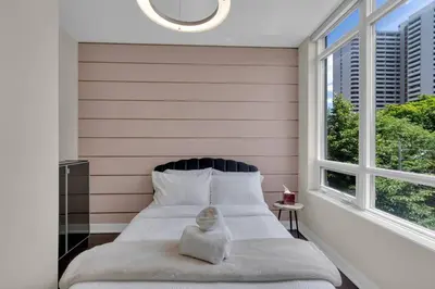 a bedroom with a bed with a stuffed animal on it at 1560 sqft Elegant Condo at Downtown Hi-End Shopping & Dining Area - CN Tower View, Bidet, LockBox in Toronto