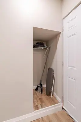 a door into a closet with a vacuum at ENTIRE 1 BEDROOM APARTMENT ACROSS FROM GOOGLE - br1 in Kitchener