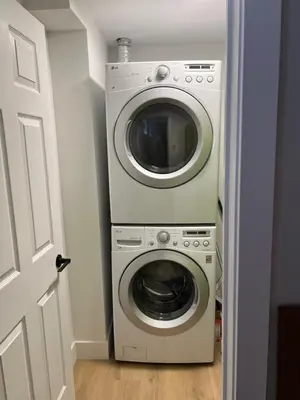 a washer and dryer in a small room at Luxurious Private Apartment in Oakville