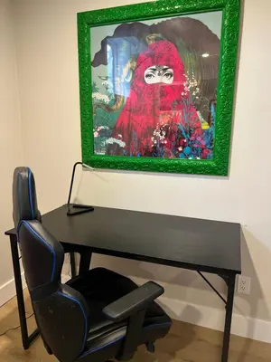 a desk with a chair and a picture on the wall at Luxurious Private Apartment in Oakville