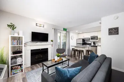 a living room with a couch and a fireplace at 1 Bed, 1 Bath Lovely Open Concept Resort Condo in Blue Mountains