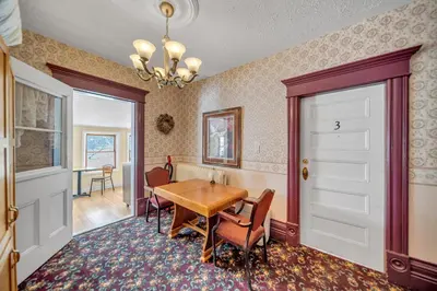a dining room with a table and chairs at Marmora and Lake Inn and Victorian Diner - Grand Victorian Suites- Level 2 in Marmora