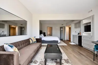 a living room with a couch and a bed at Relaxing Top Level Studio in Edgar