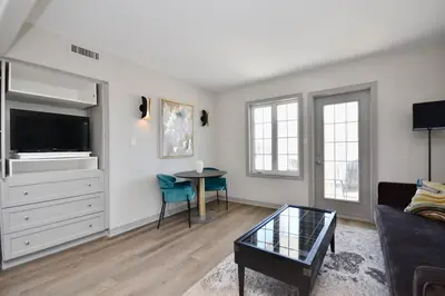 a living room with a couch and a table at Relaxing Top Level Studio in Edgar