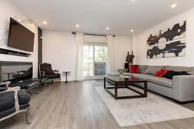 a living room with a couch and a table at Grand 3 BR Toronto Victorian Entire Home in Toronto