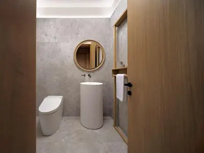 a bathroom with a toilet and a mirror at Nobu Hotel Toronto in Toronto