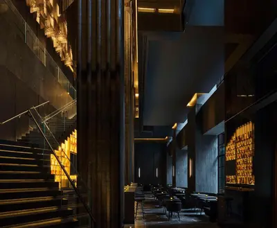 a hallway with chairs and stairs in a building at Nobu Hotel Toronto in Toronto