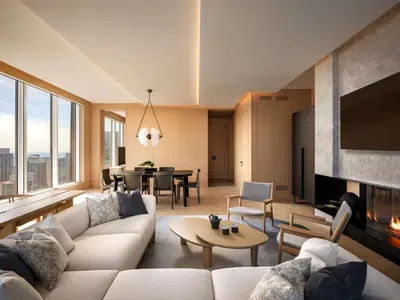 a living room with a couch and a fireplace at Nobu Hotel Toronto in Toronto